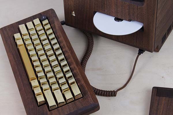 The Macintosh 128k Replica with a Wooden Housing and Gold Keyboard